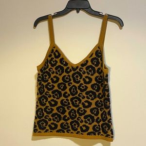 Cute cheetah printed string blouse and it has a soft almost blanket texture.